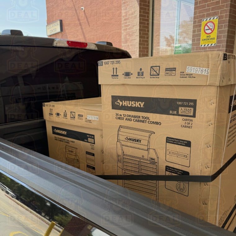 Two boxed Husky 36 in. 12-drawer tool chest combos loaded in a truck bed outside a Home Depot.