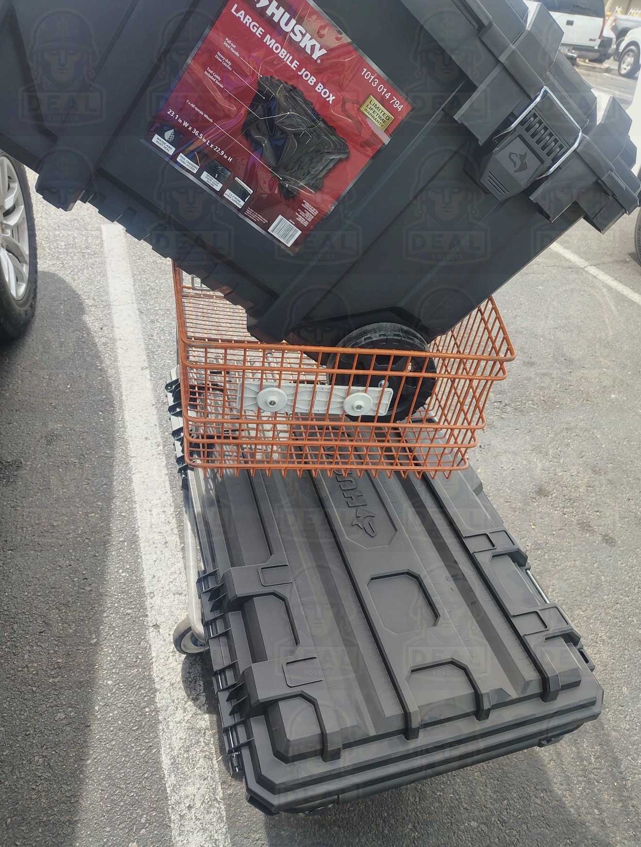 Husky Large Mobile Job Box stacked on a Husky Medium Rolling Toolbox on top of a Home Depot orange flat cart in a Home Depot parking lot, the result of an Alfredo penny deal find.